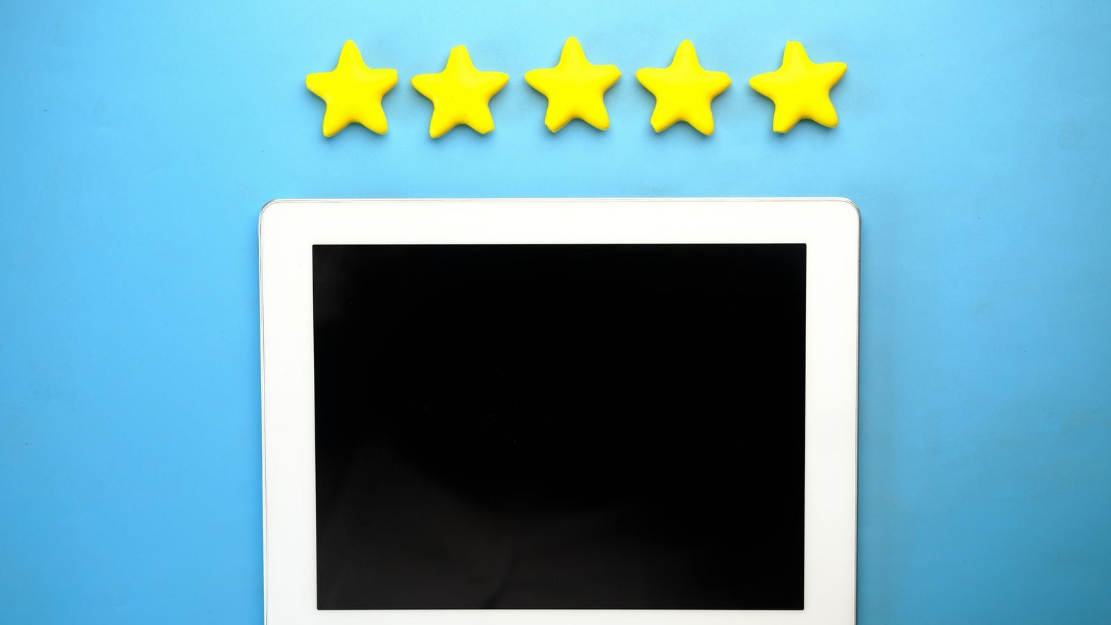 Five yellow stars above a tablet on a blue background representing online reviews