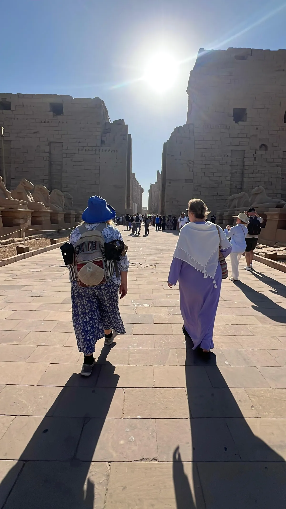 Two women walking at Karnak temple