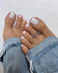 Finished manicure with glossy nude polish