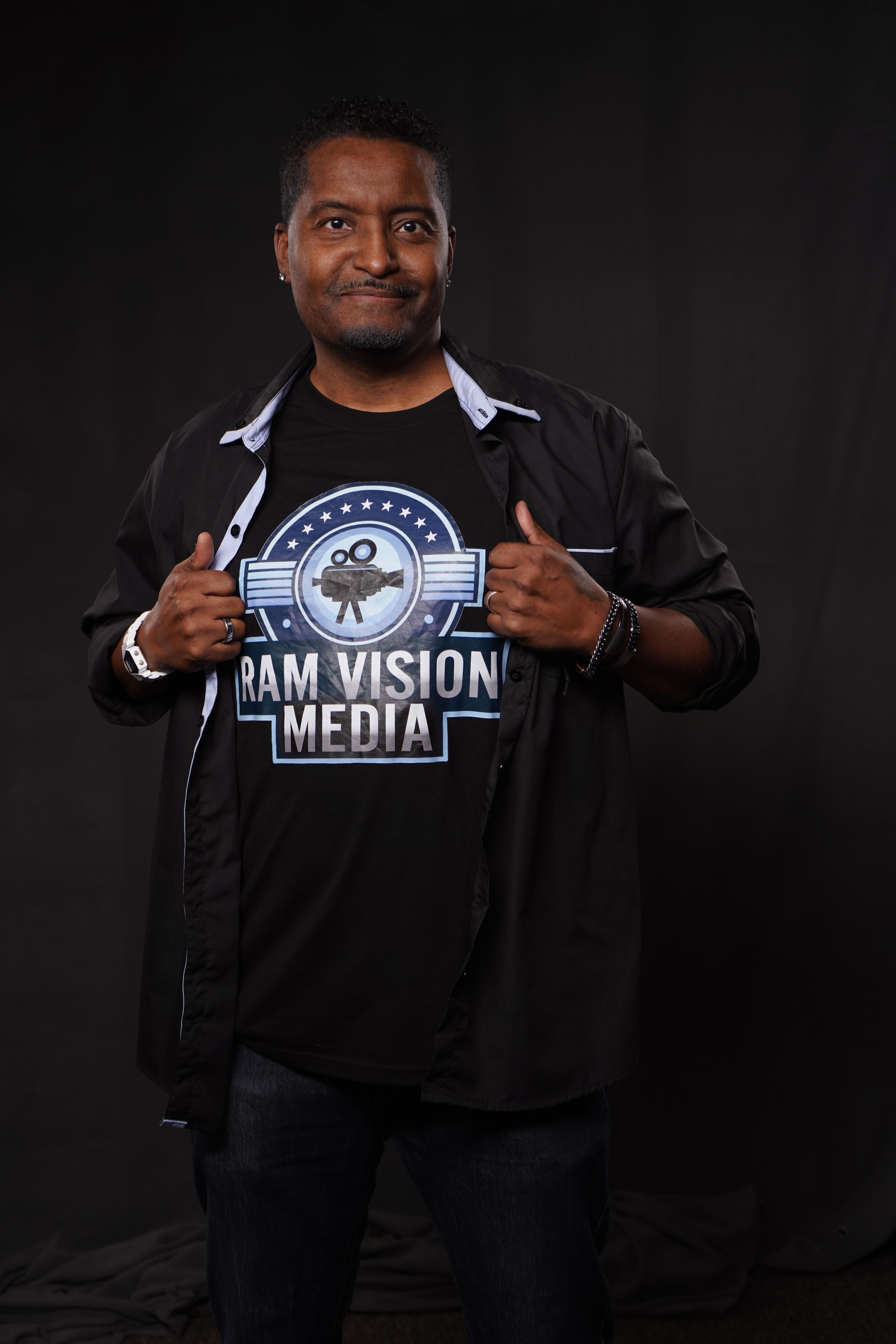 Portrait of John Doe, Creative Director, in a cinematic studio setting, confident expression, blue accent lighting, modern attire