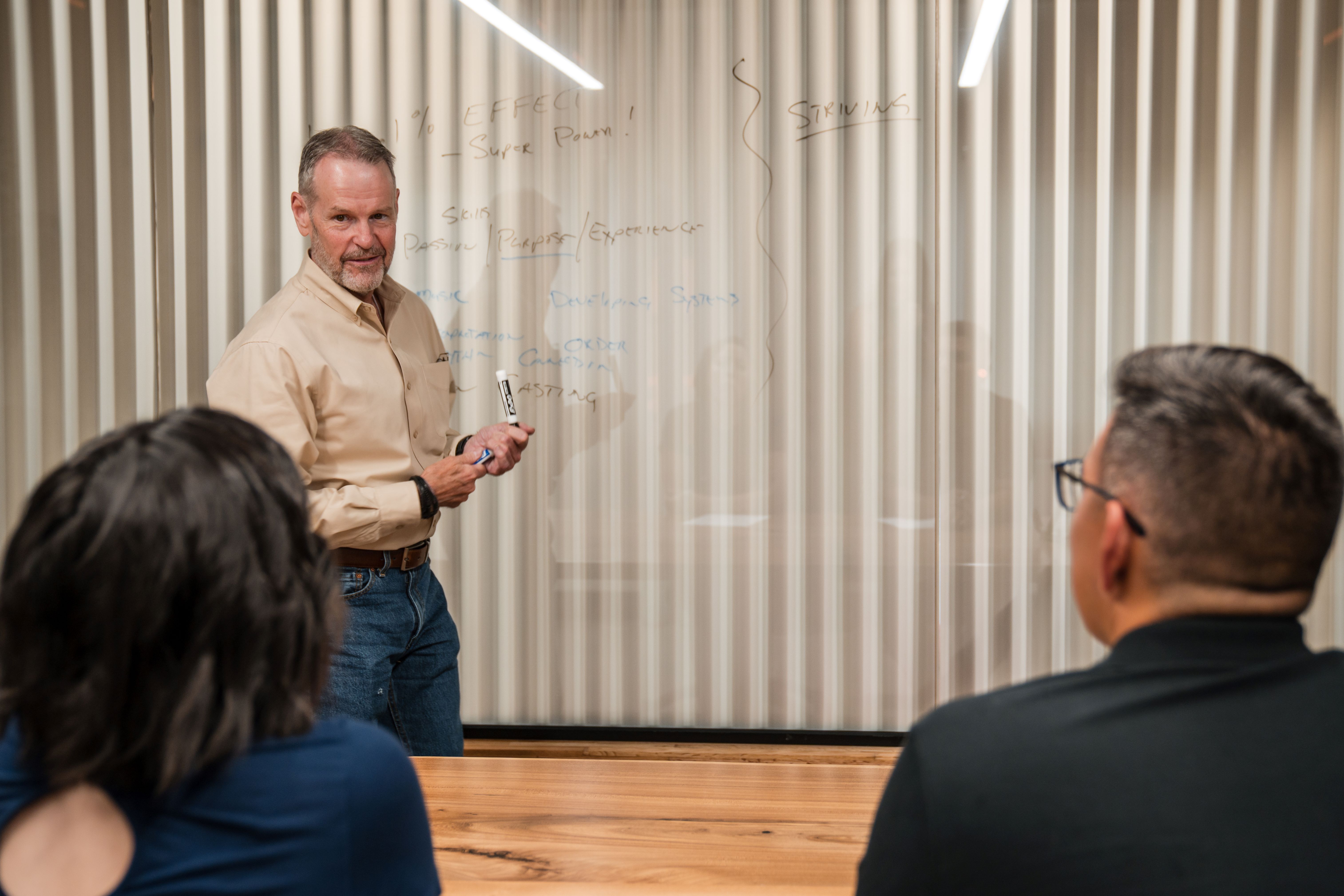 Jeffrey S. Simpson working with an organizational team.