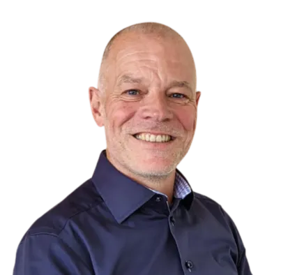 two women standing in front of white dry erase board