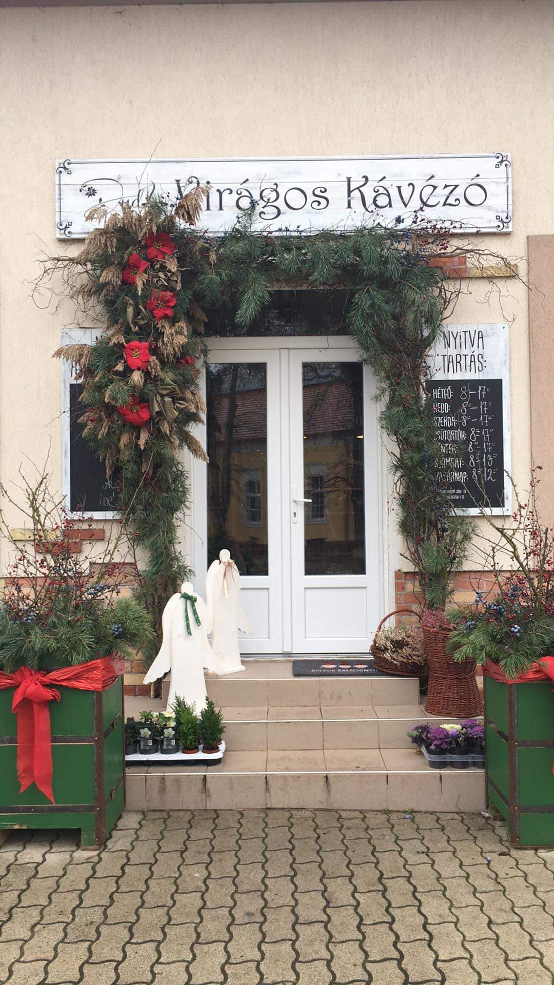 Store exterior shot: boutique storefront with branded awning, daylight, customers entering, clear signage, warm street-level perspective, depicts physical location and inviting entrance.