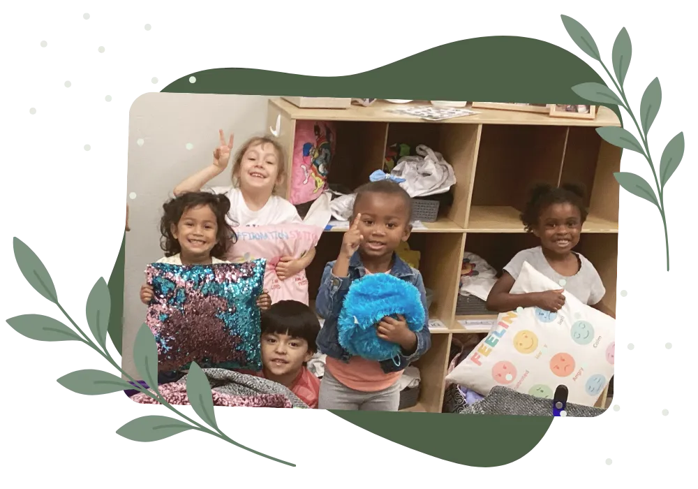 Group of smiling children playing together with colorful pillows in a childcare classroom
