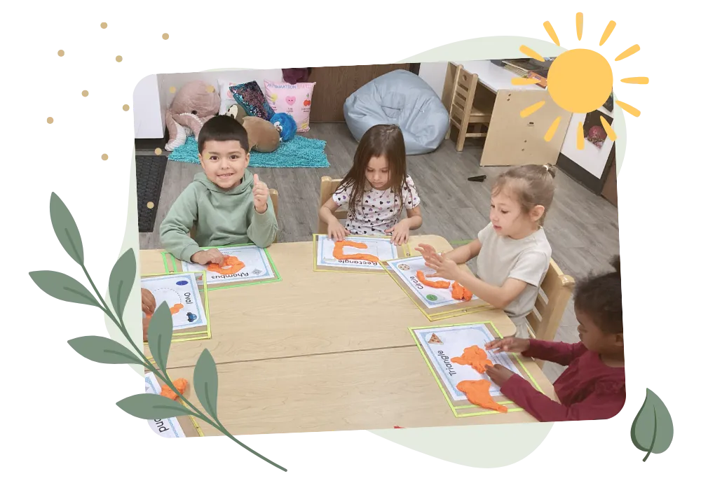 Children enjoying a hands-on classroom activity together at BAES Education Center