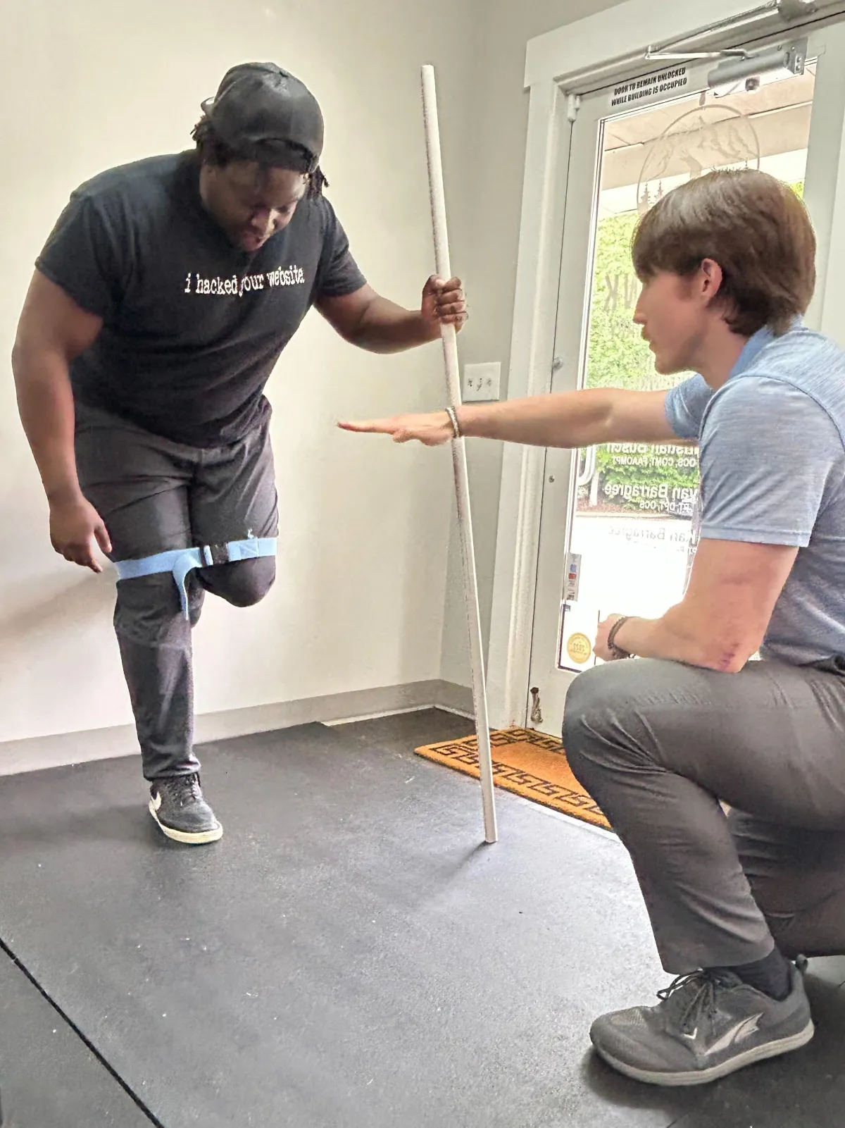 A man is playing with a child in a room