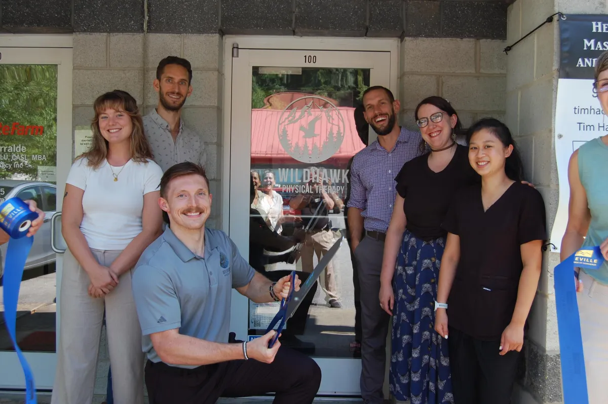 A PT team at their chamber ribbon cutting in Asheville, NC