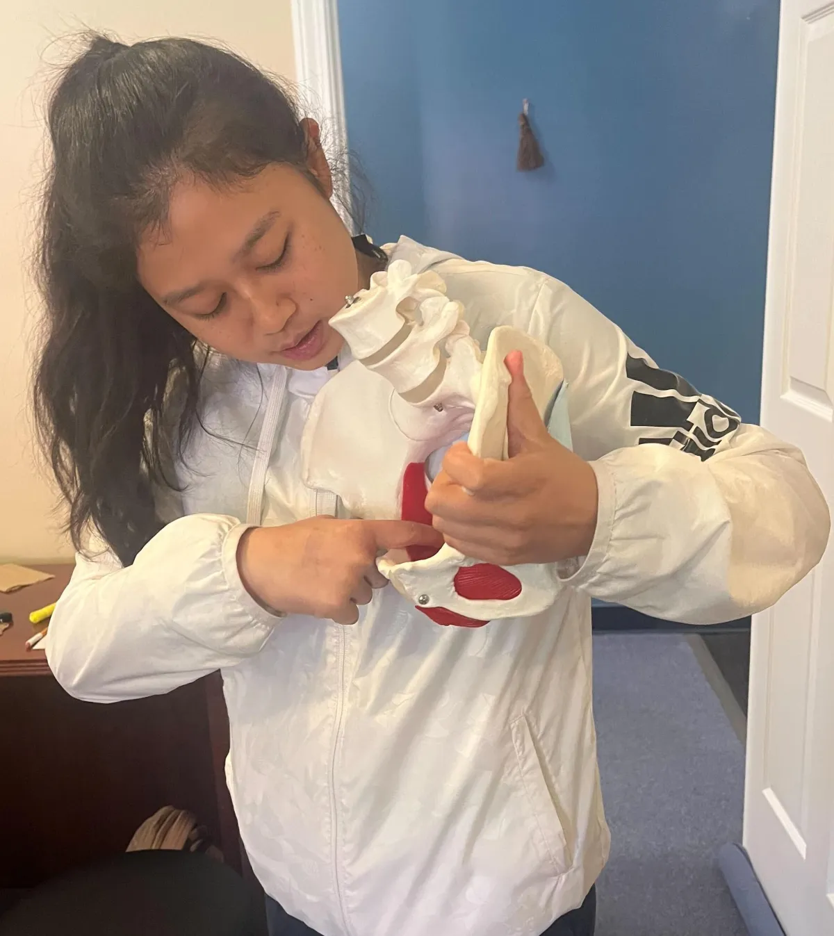 physical therapist assessing a man's knee