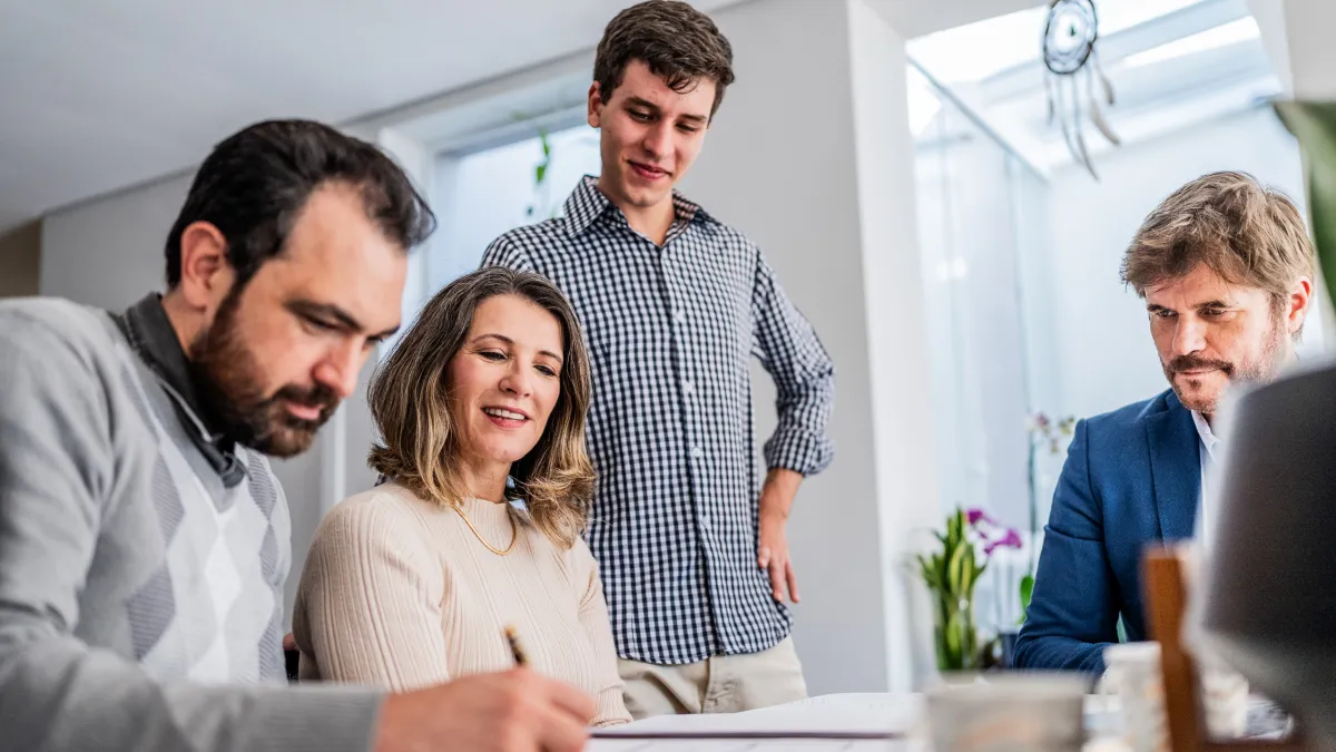 Modern city skyline with green spaces and buildings.