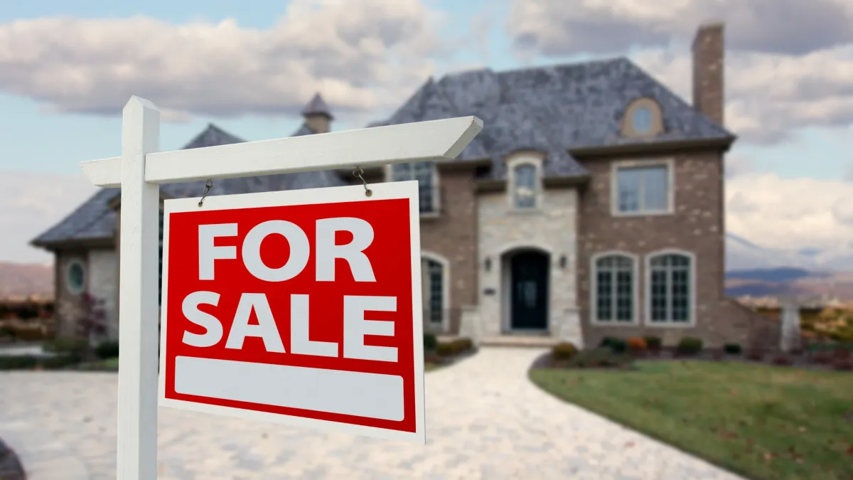 A padlock secures an old wooden door