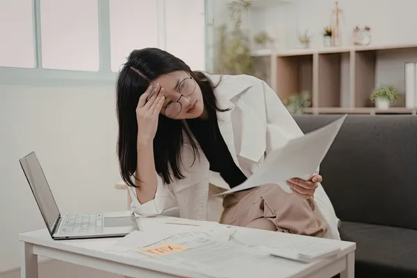 Woman reviewing her symptom history and patterns as a tool for understanding her chronic health picture