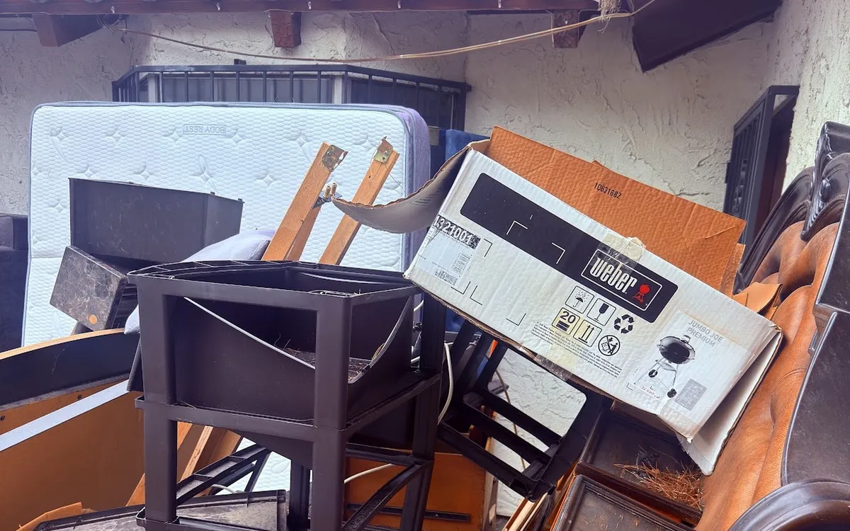 Old appliance and furniture loaded for haul away