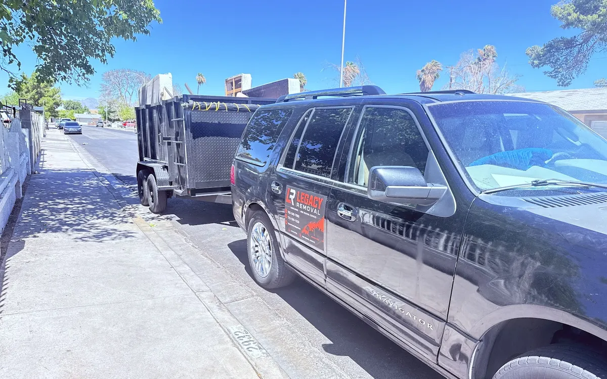 Legacy Removal Company truck and trailer ready for hauling