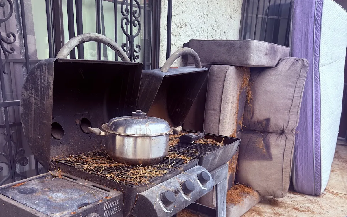 Old grill and outdoor items ready for junk removal