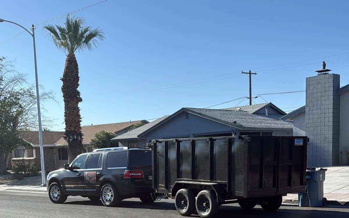 Dump trailer parked at a residential hauling job
