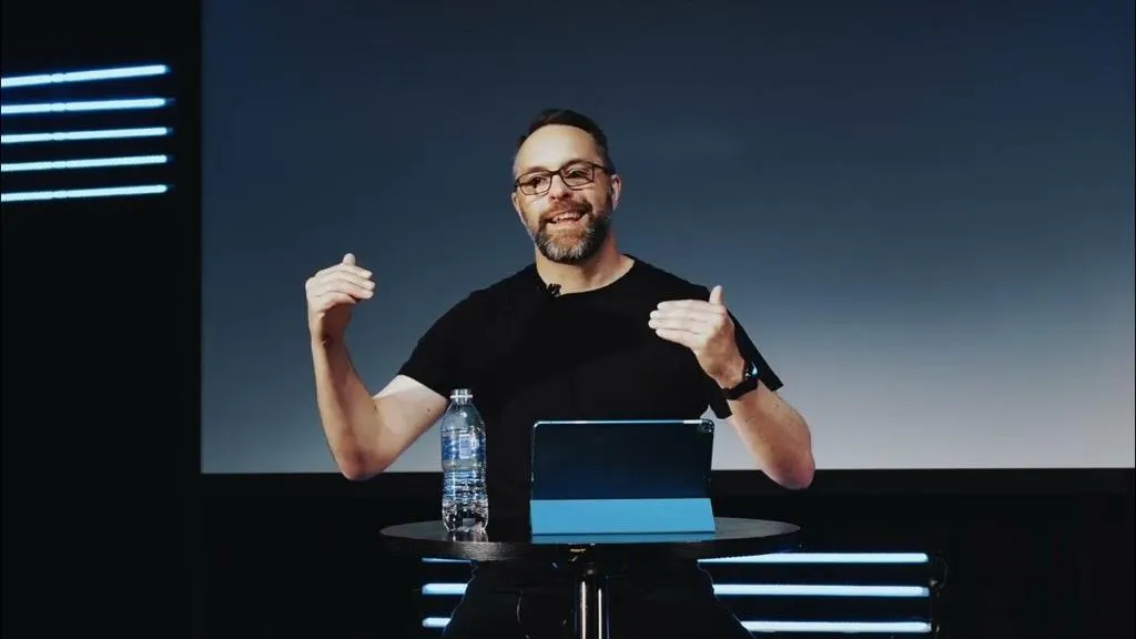 Julian Clark of the 19 Project delivering a talk on Leadership from the stage