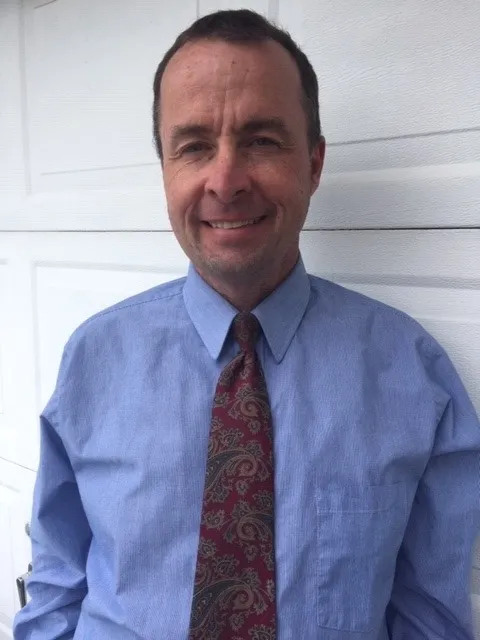 Barry Sanborn, Missouri money coach and financial coach, wearing a shirt and tie