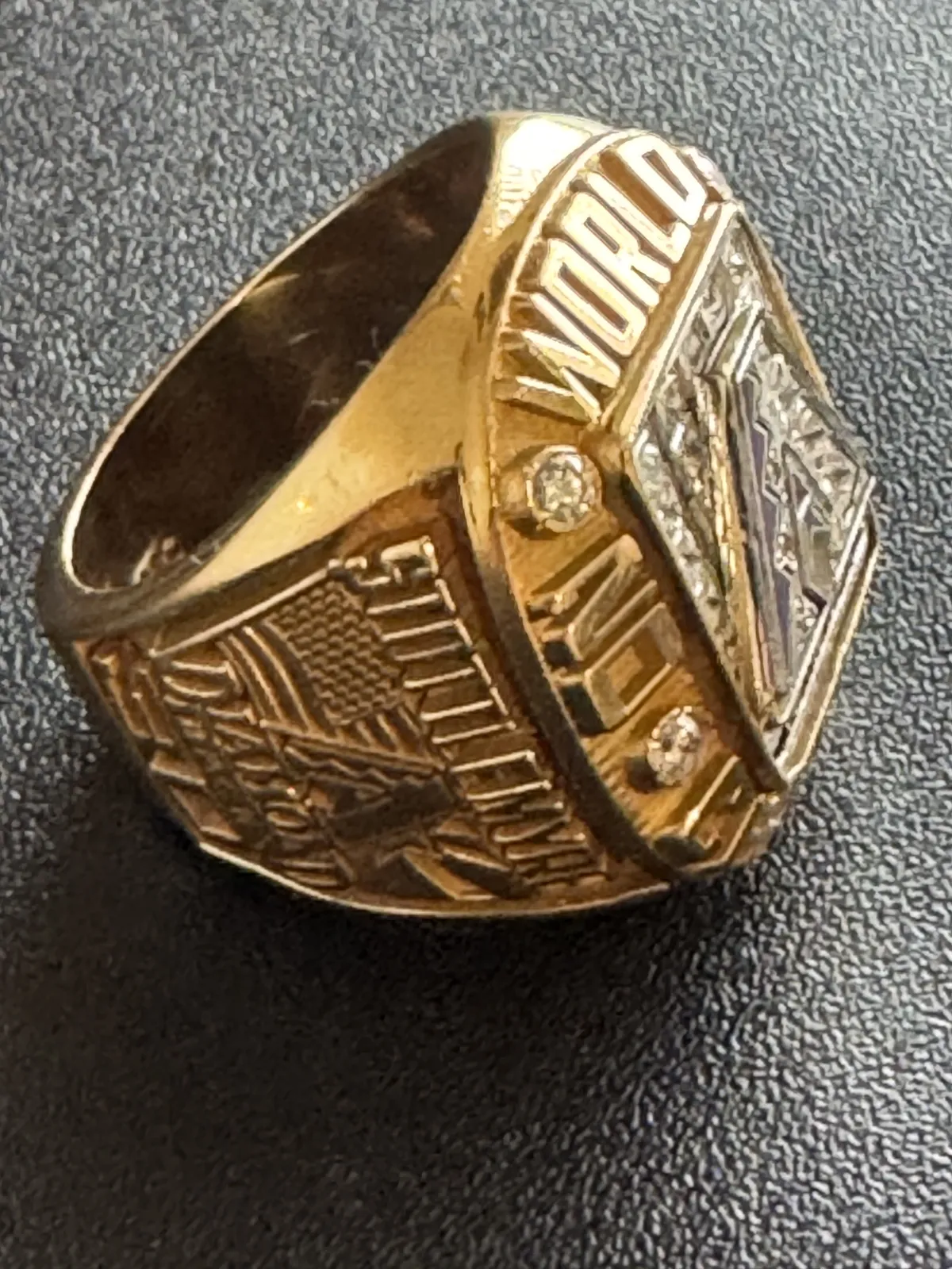 Close-up of Todd Stottlemyre’s 2001 Arizona Diamondbacks World Series Championship ring, featuring a gold band, diamond accents, and detailed championship engravings.
