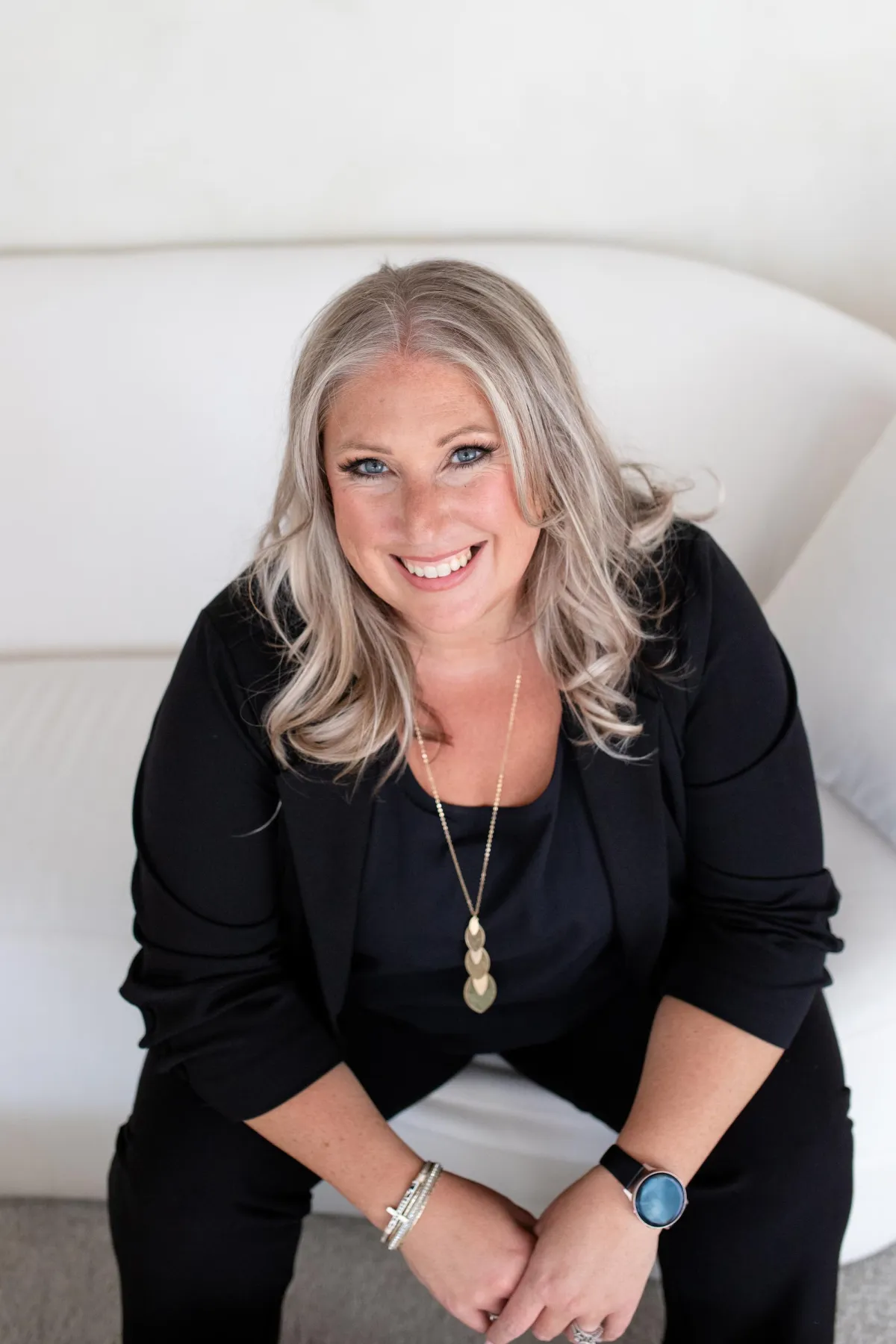 Kristyn looking and smiling at camera