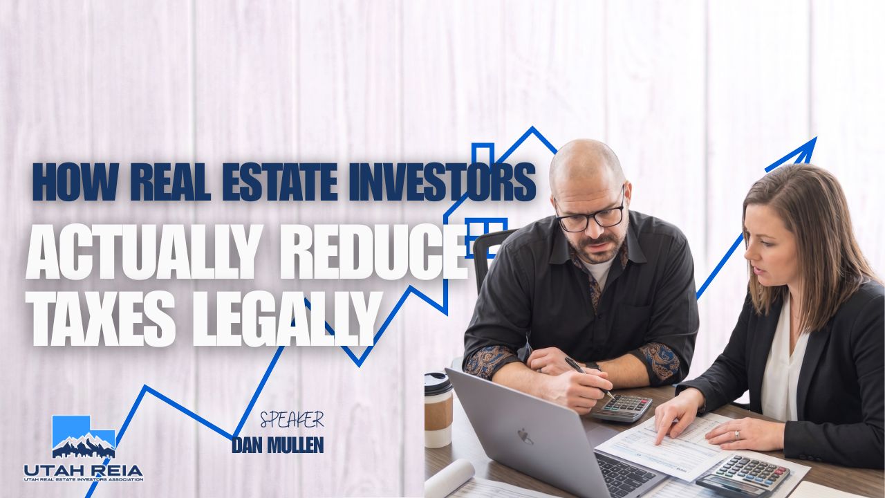 Real estate investor reviewing rental property tax deductions and entity structure documents at a Utah REIA strategy event.