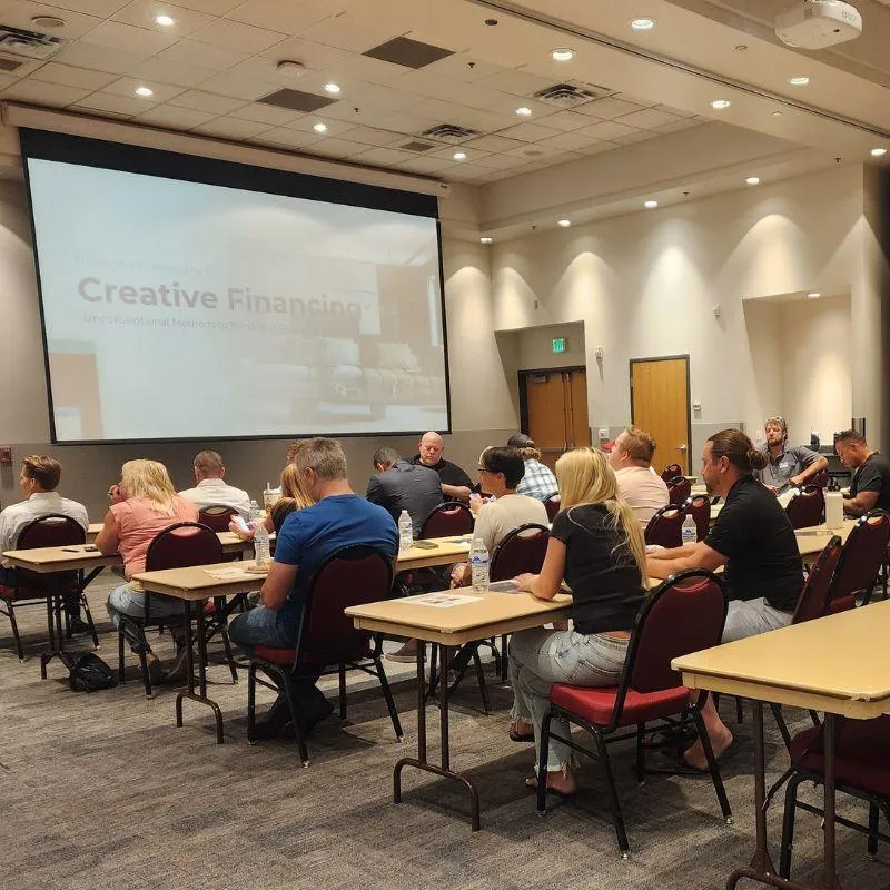 Real estate investors attending a Utah REIA monthly meeting focused on creative financing strategies