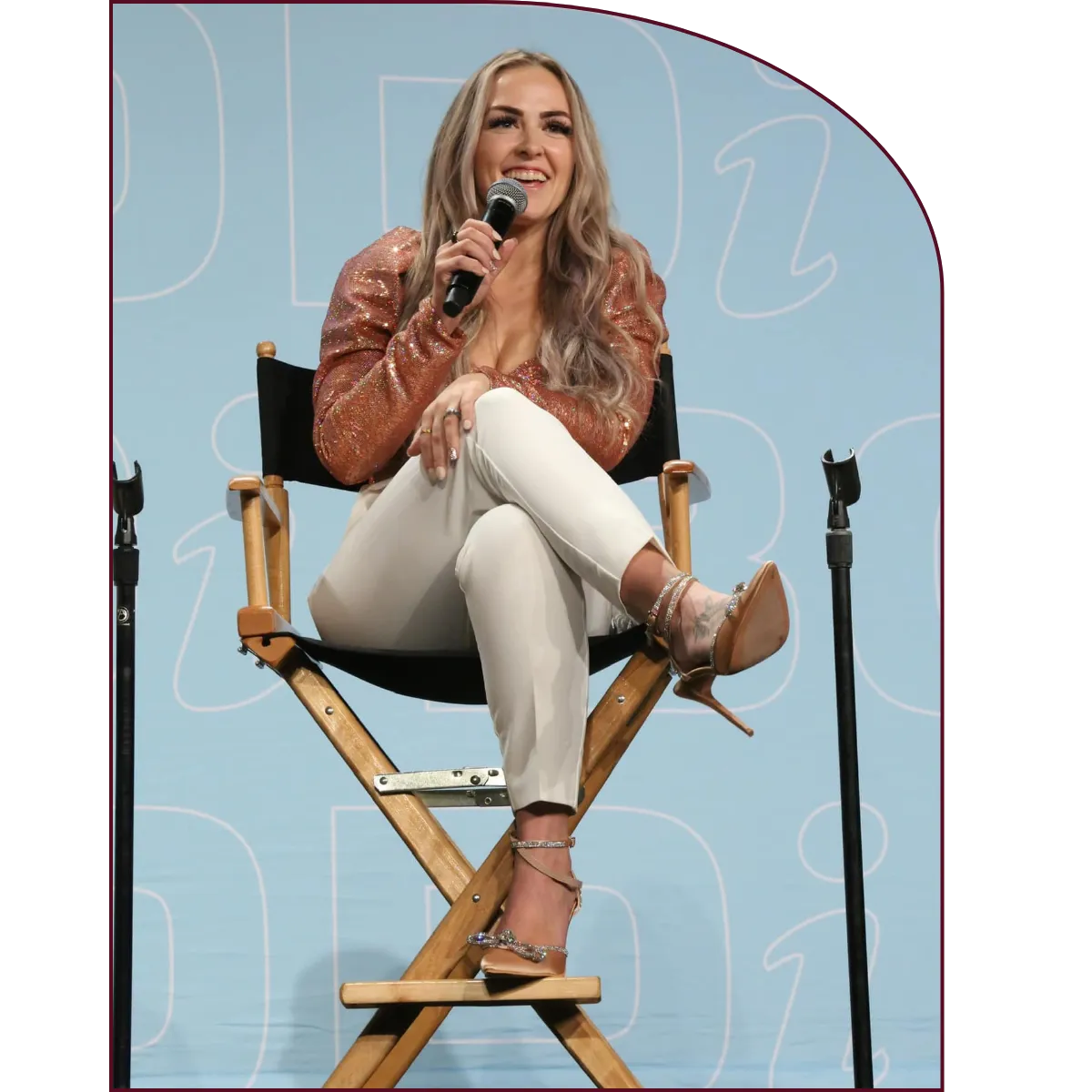 Stephanie Noble speaking on stage at a personal development event