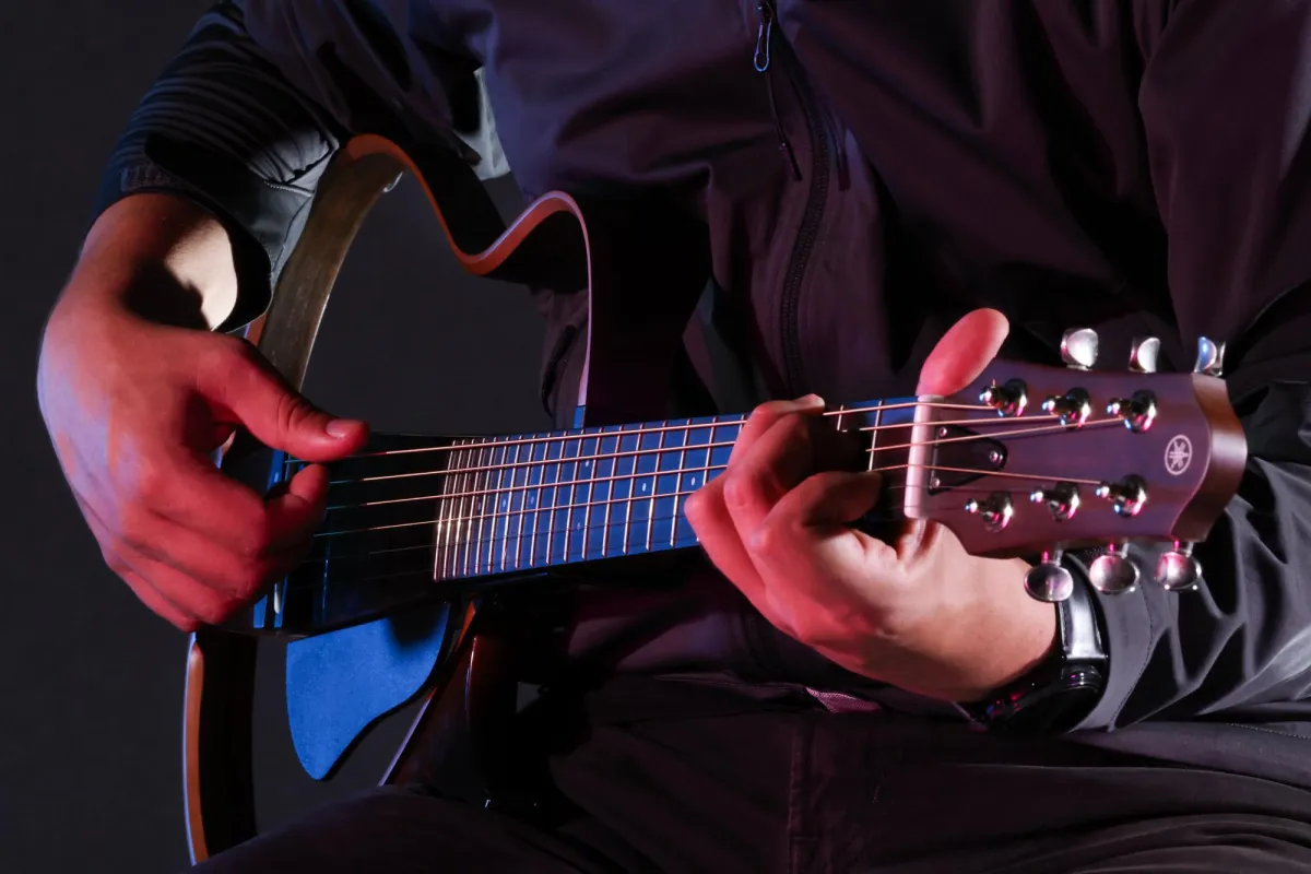 Guitar player in photo studio. 