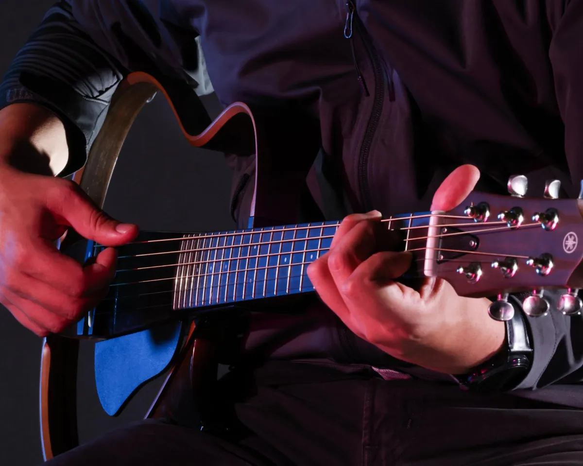 Guitar player in photo studio.