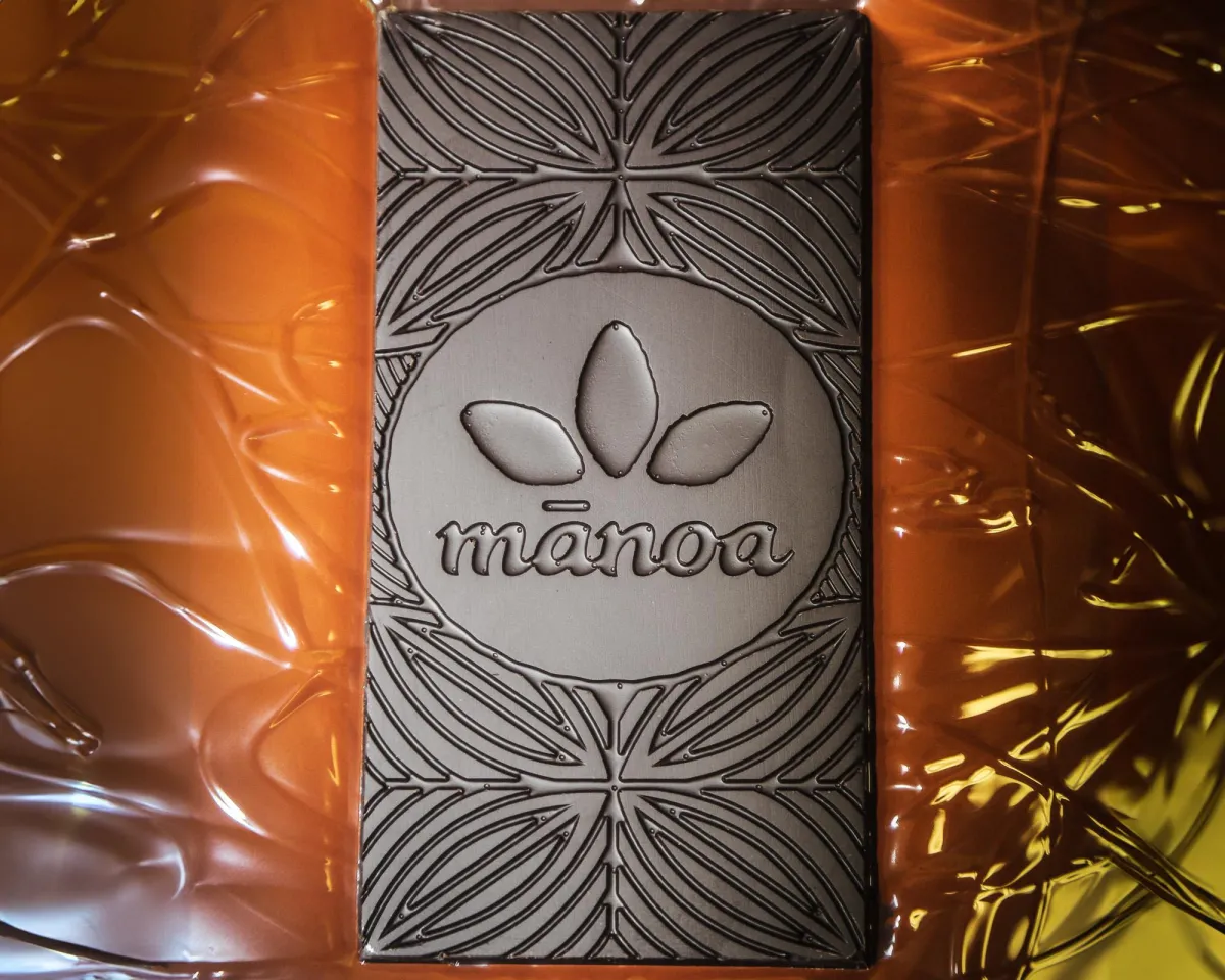 Manoa chocolate bar in melted chocolate. 