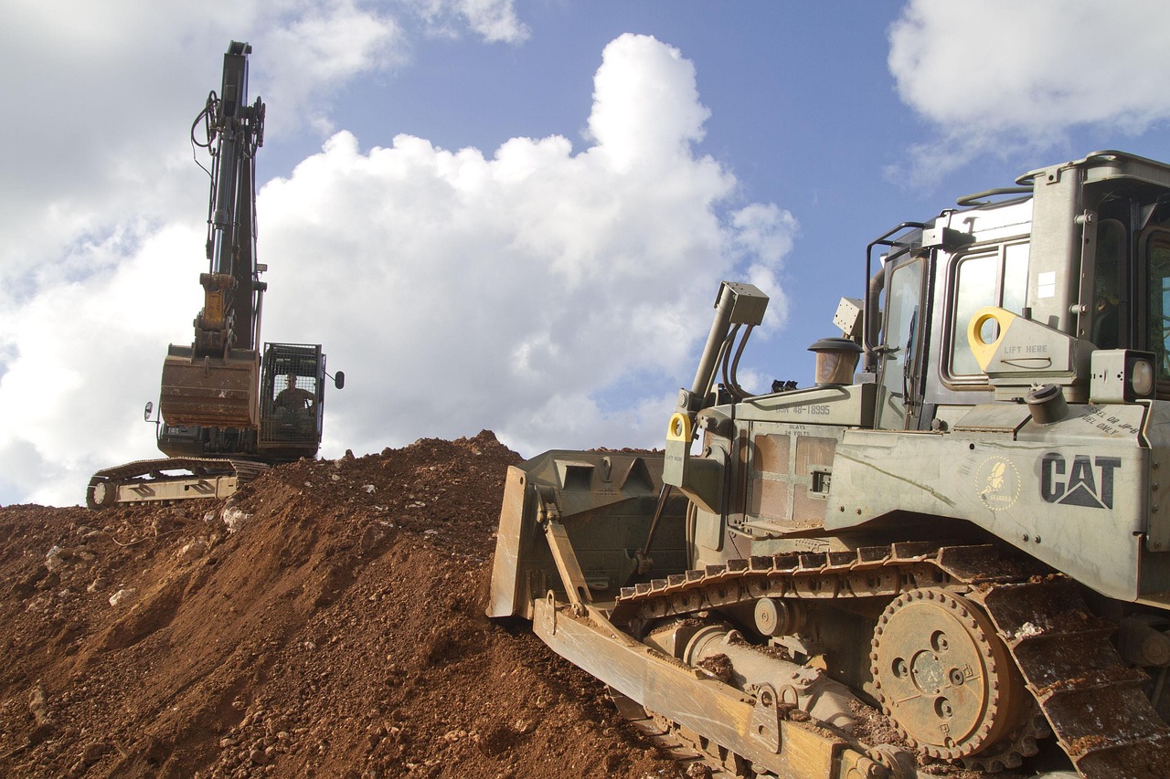 a backhoe and other excavation equipment on construction jobsite