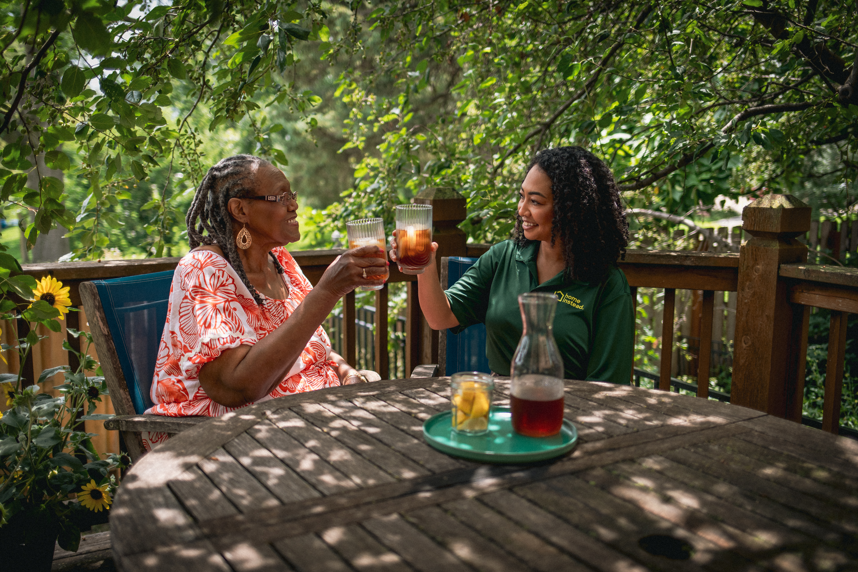 Caregiver and senior sharing a laugh