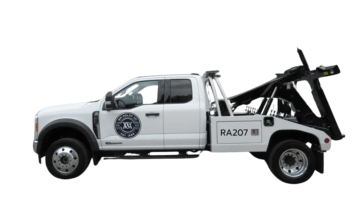 Worker loading vehicle with packages ensuring safe and organized transportation.