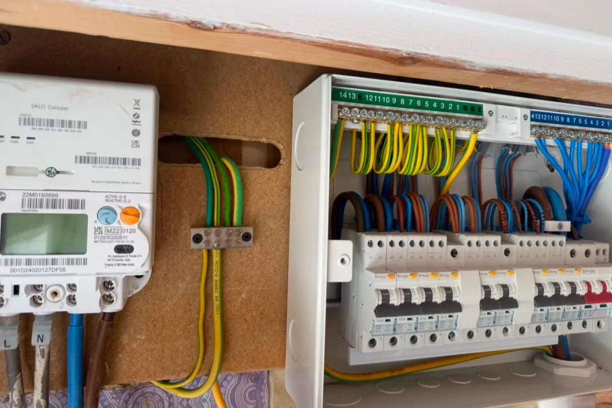 Electrician in Oxford checking the wiring in a house