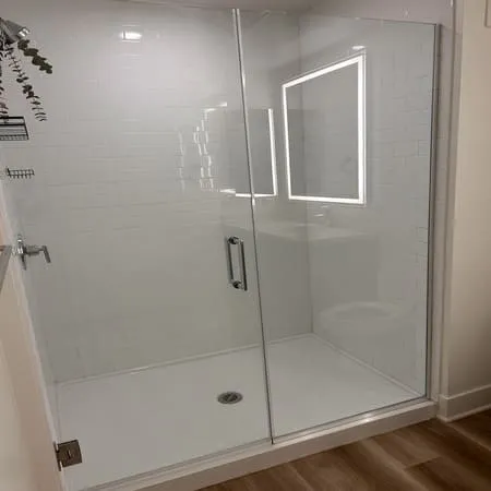 Glass shower after hard water removal during a Phoenix move-out cleaning
