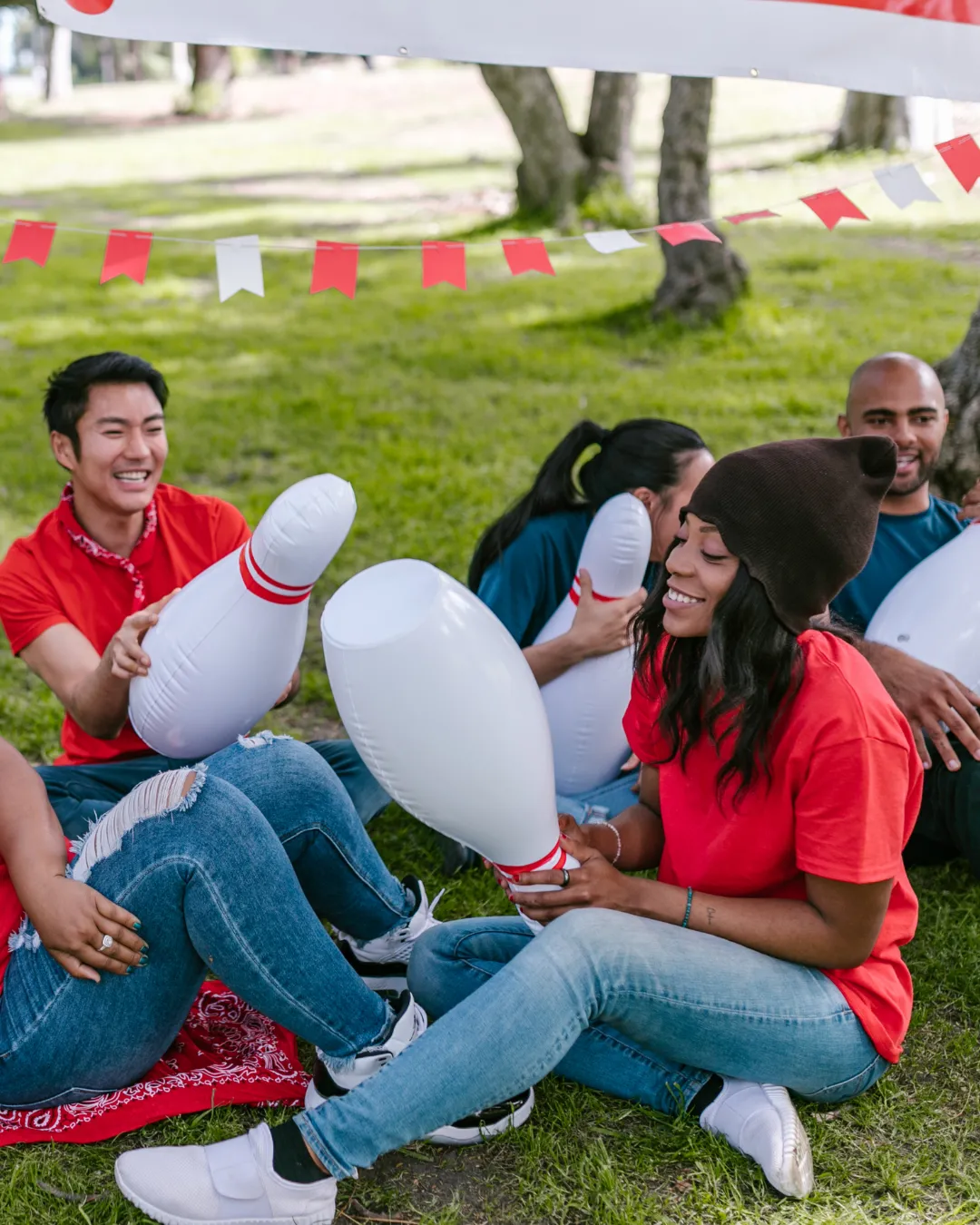 Field day games enjoying time as a group of friends outside doing lawn bowling