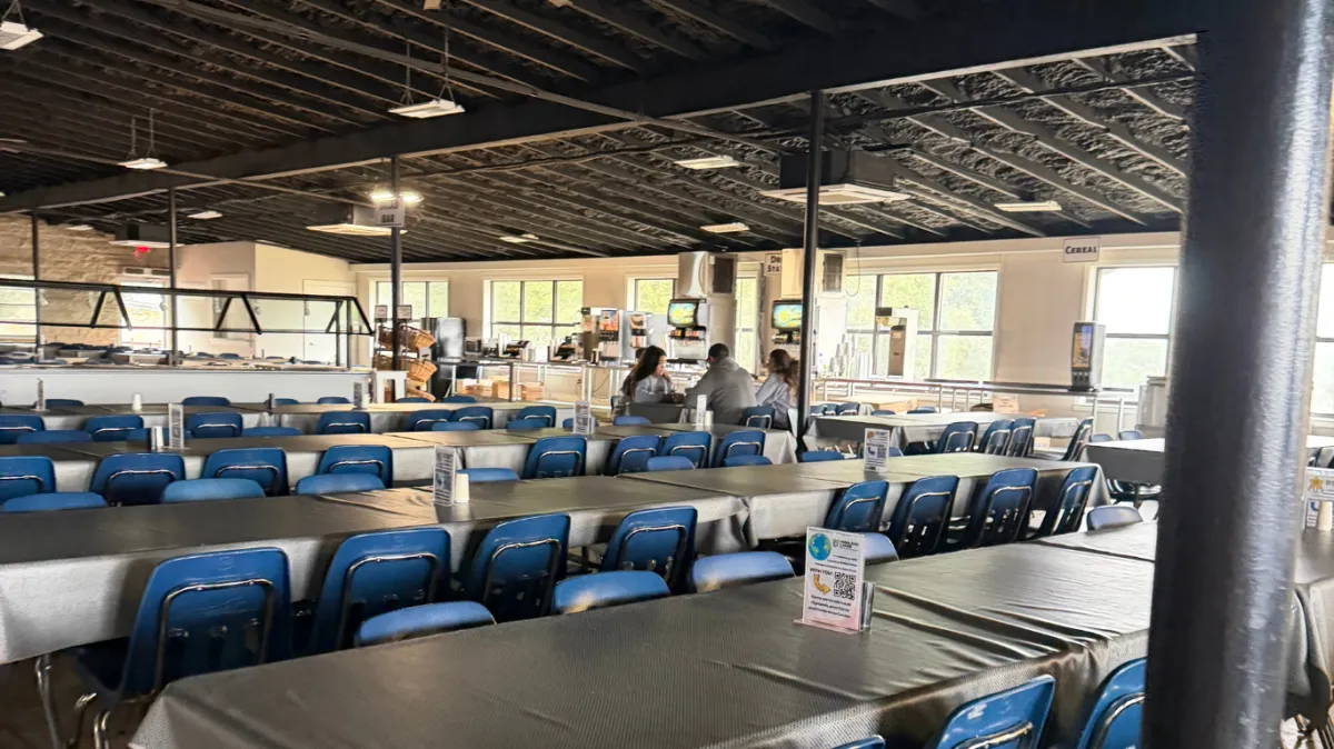 Dining hall at camp. Tables and chairs set up