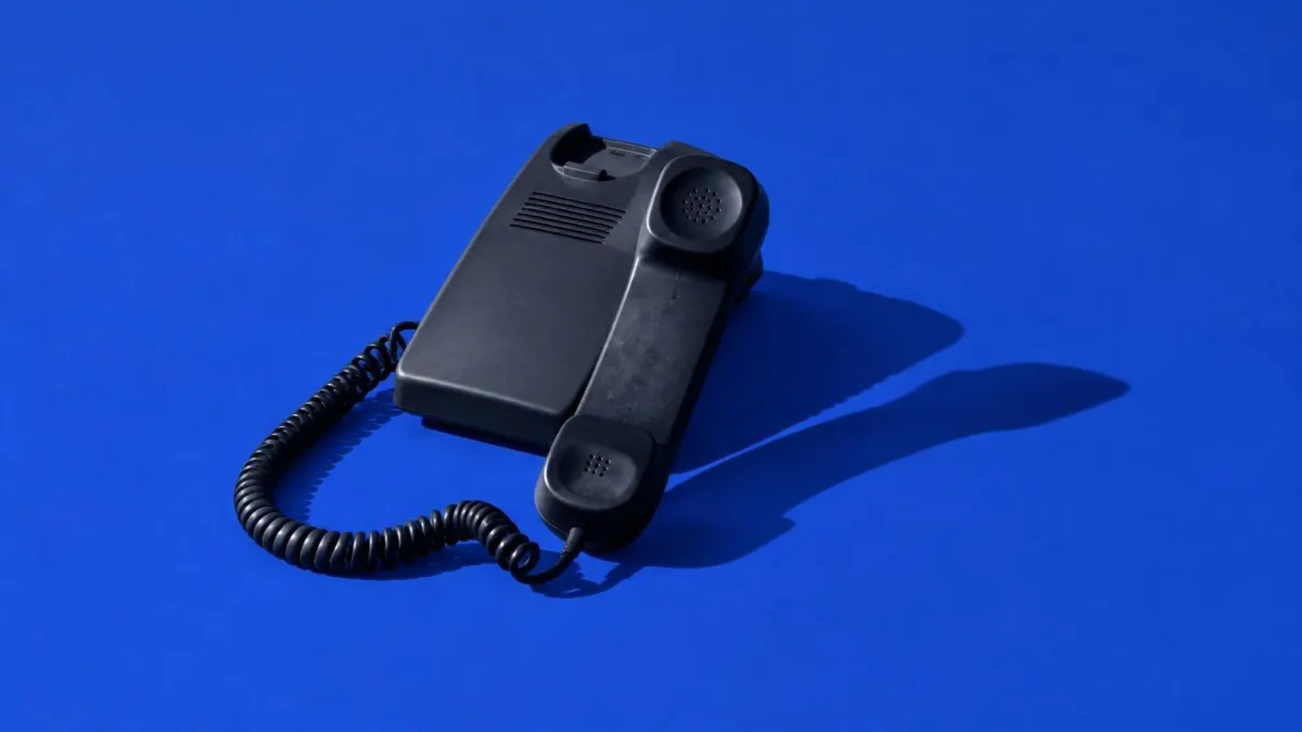 Owini Conversica alternative for dealerships: AI BDC placing an outbound call to a new internet lead while a text thread updates on screen