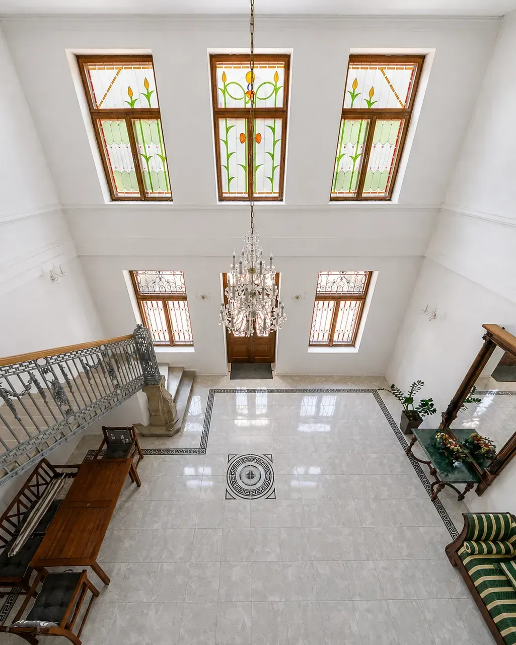 Stained-glass window and crystal chandelier
