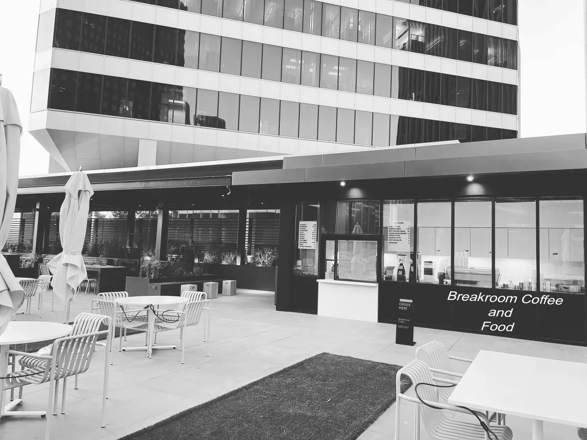 A building with a car parked in front of it