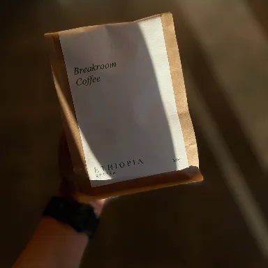 brown coffee signage beside poster