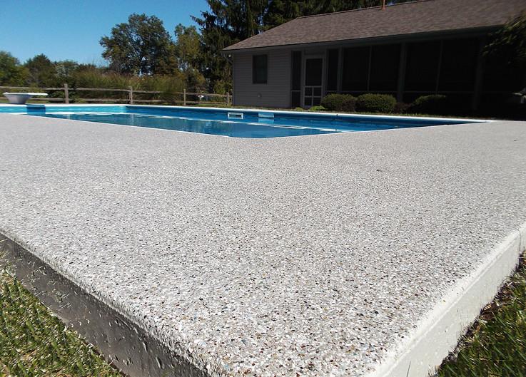 Resurfaced pool deck with bench