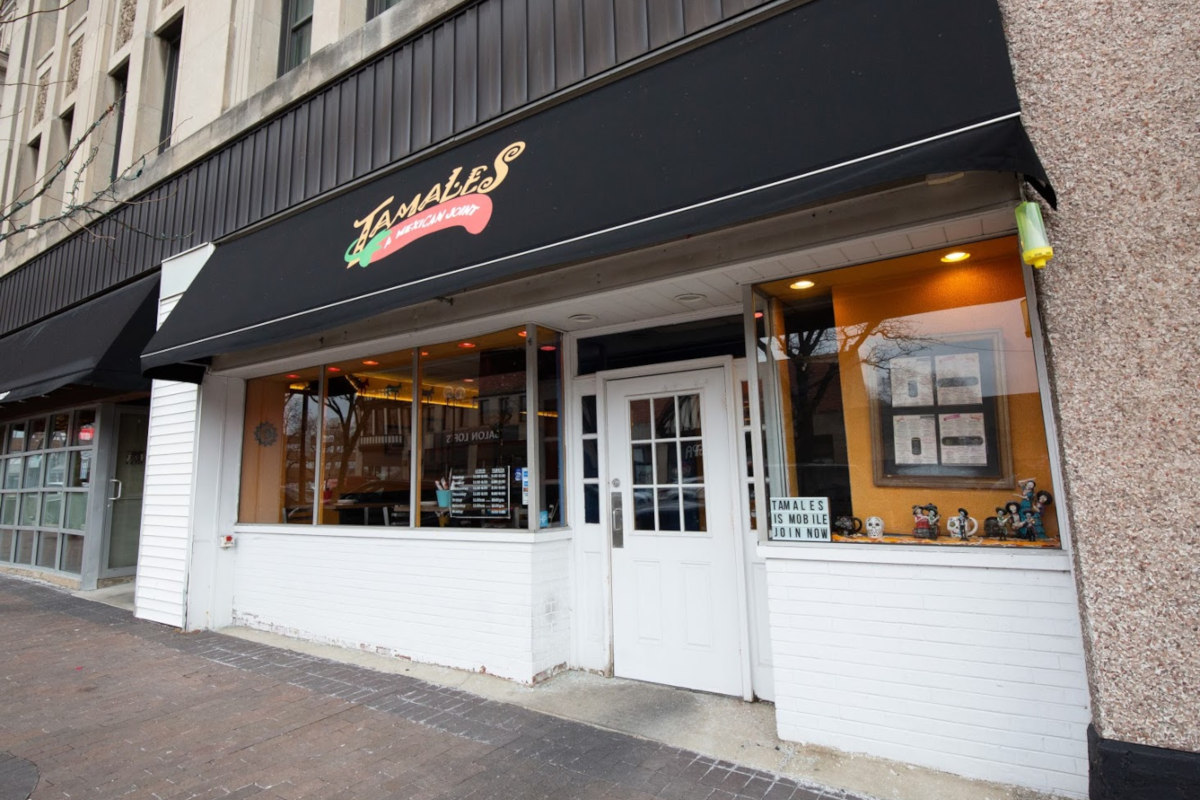 Modern Mexican restaurant interior with guests enjoying food and margaritas