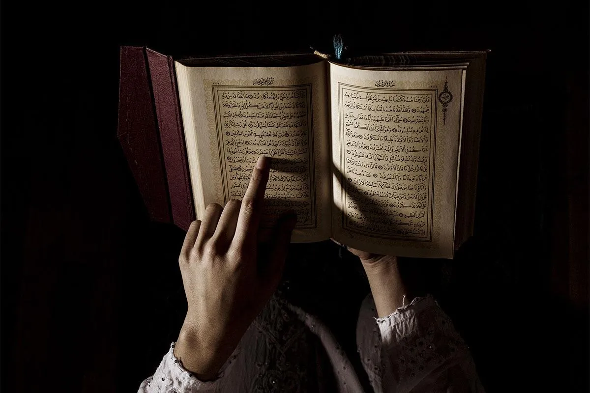 a person reading quran, Online Quran from home