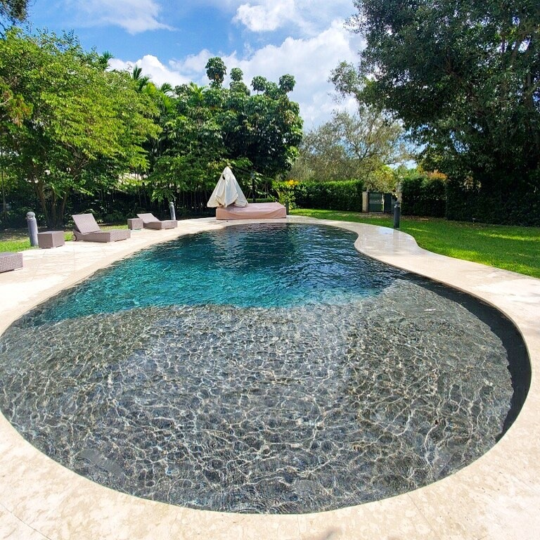 Custom pool consultation and concept planning - modern pool with water features and palm trees by Gables Pool Miami