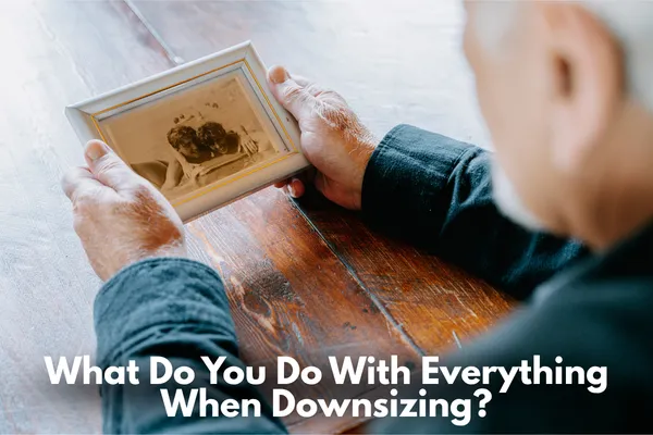 Homeowner sorting through belongings and keepsakes during the downsizing process
