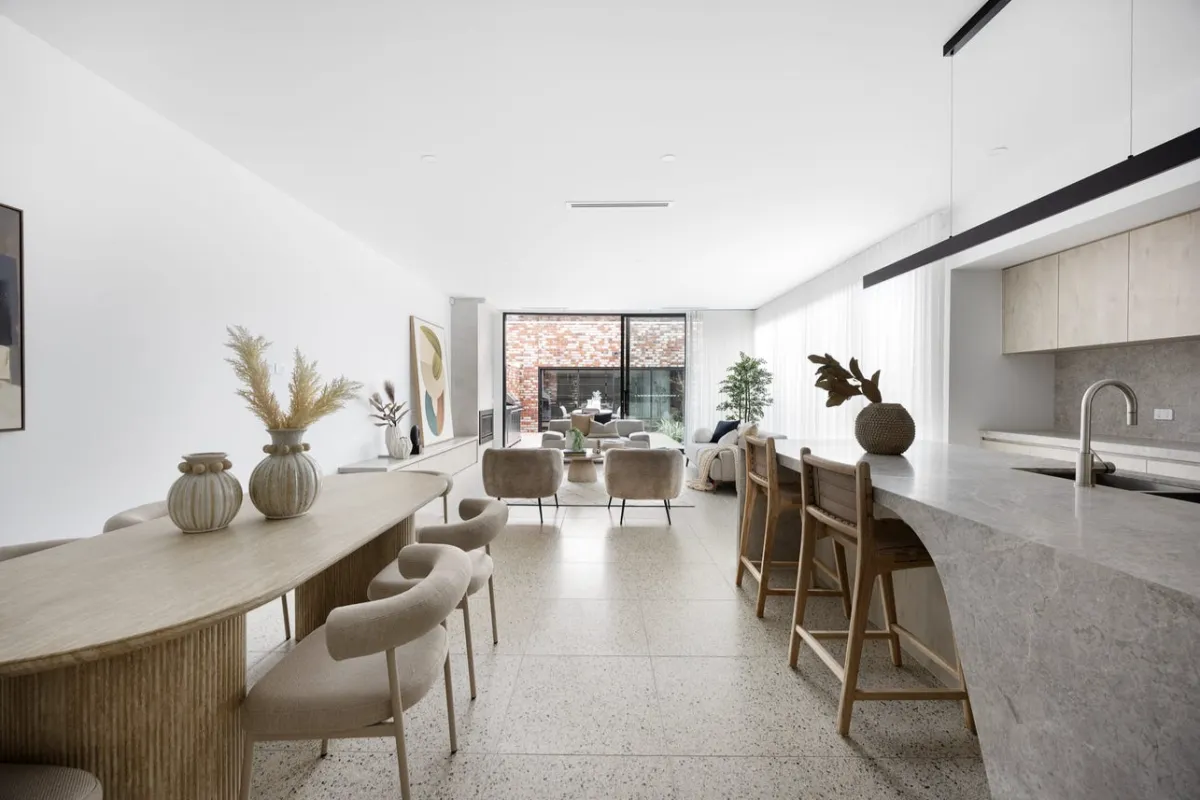 Renovated living room with wooden floors and neutral furniture