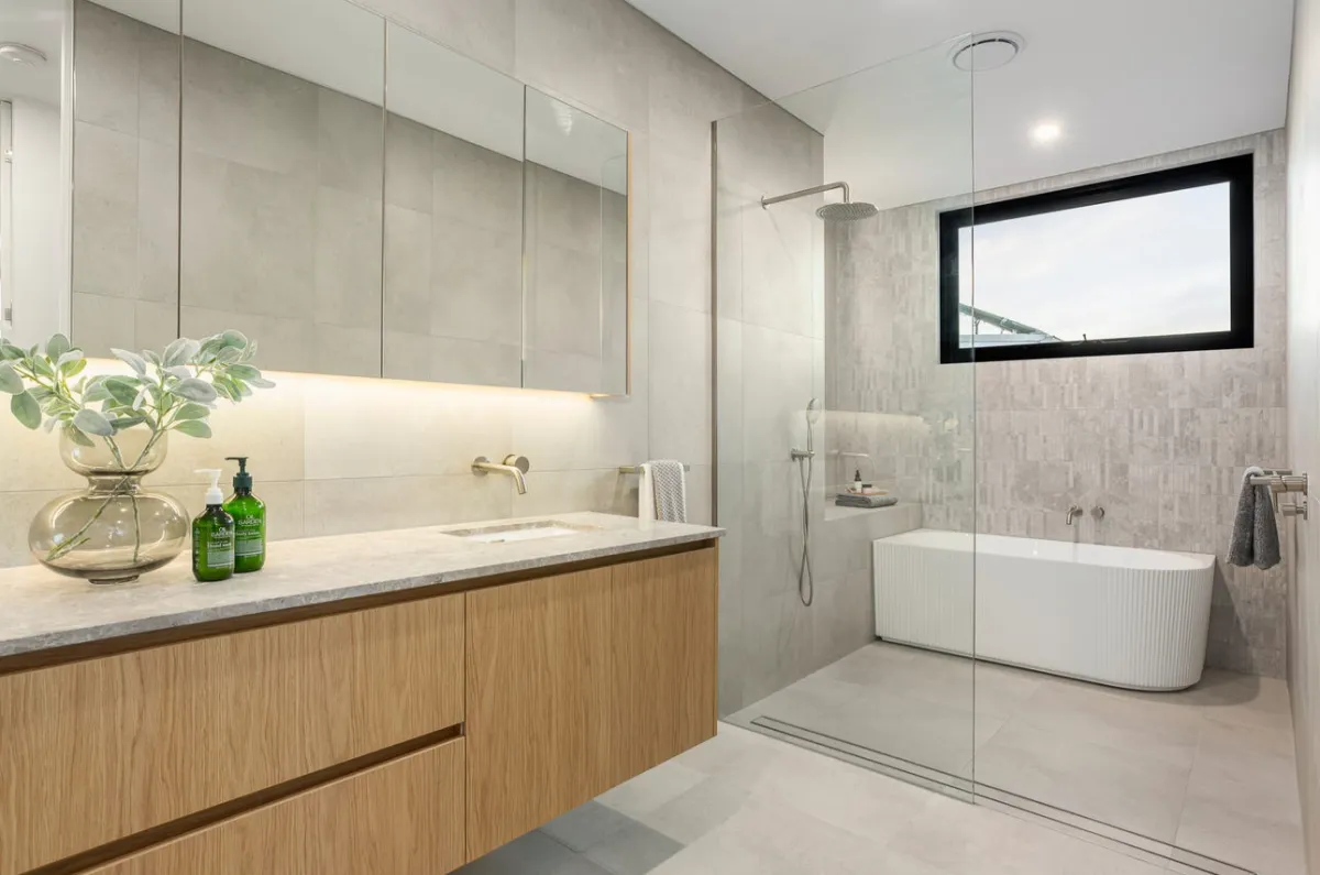 Serene modern bathroom with walk-in shower and neutral tiles