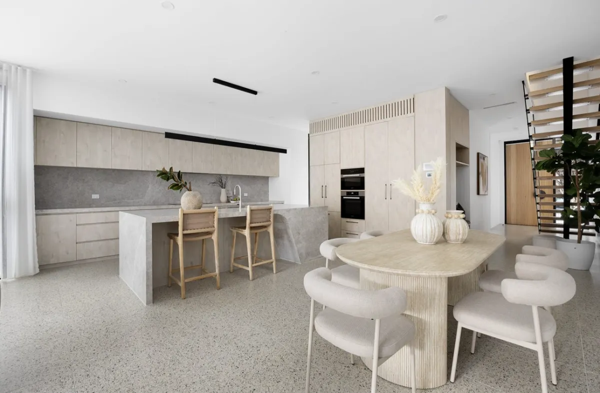 Modern kitchen renovation with island and integrated appliances