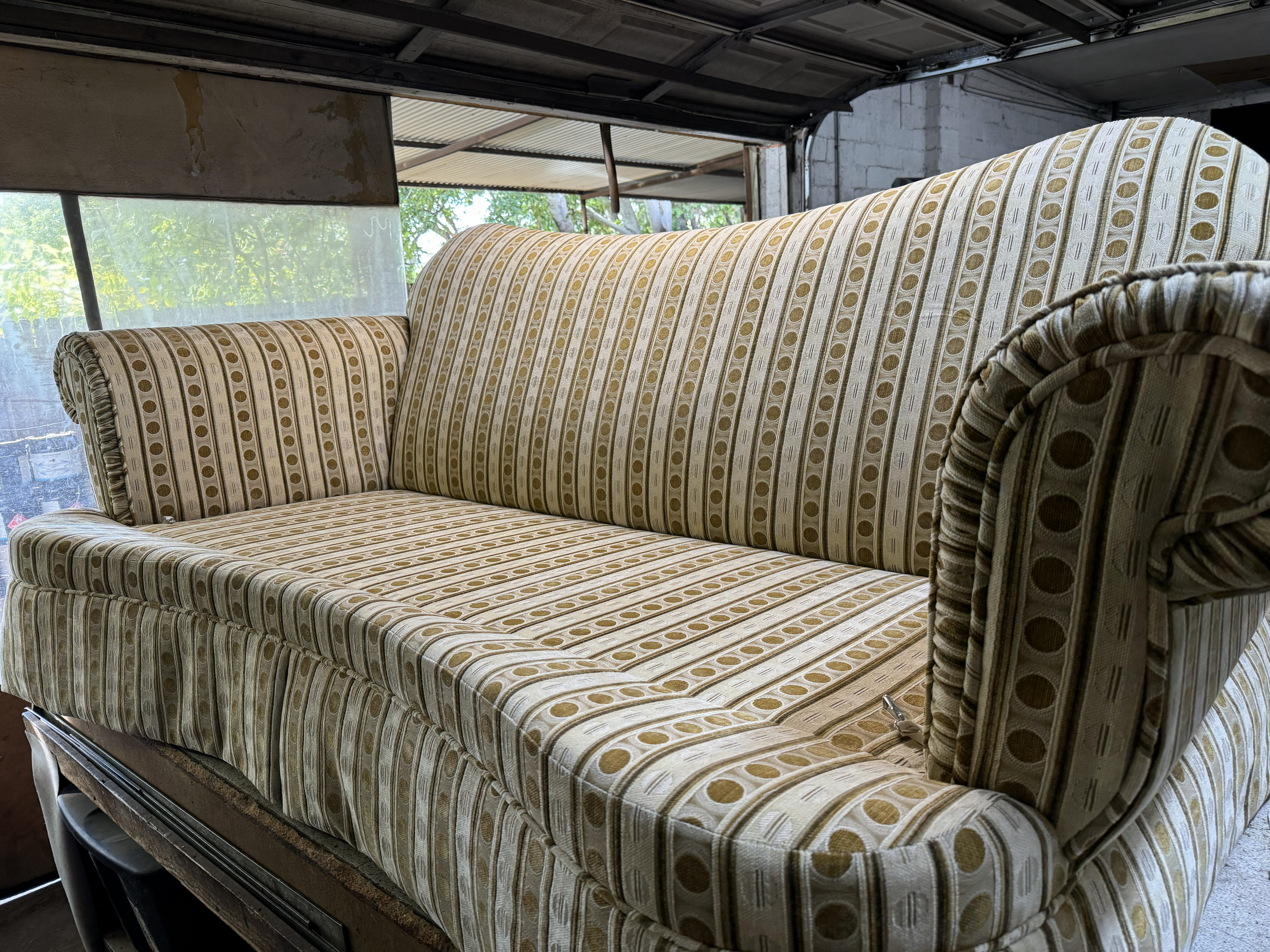 After: restored couch with clean fabric and refreshed cushions