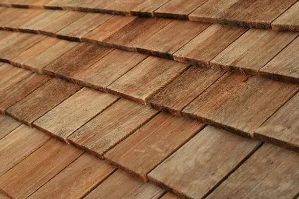 Up-close view of cedar roofing shakes, highlighting eco-friendly materials.